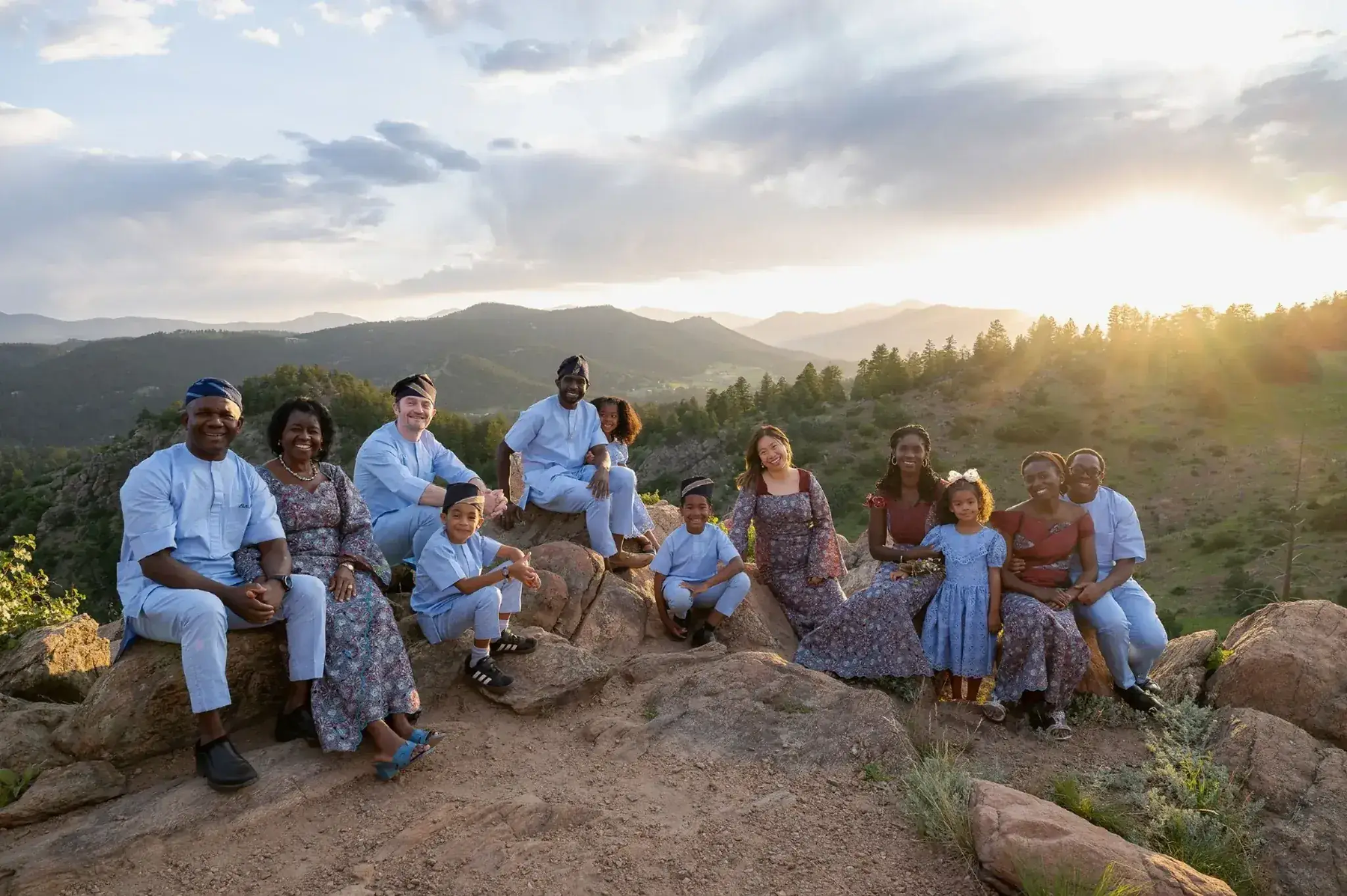 A large family group photographed at sunset in Denver, Colorado, by photographer Ryan Kost