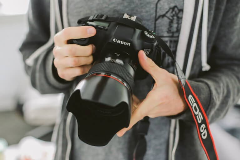 Professional photographer with Canon DSLR camera