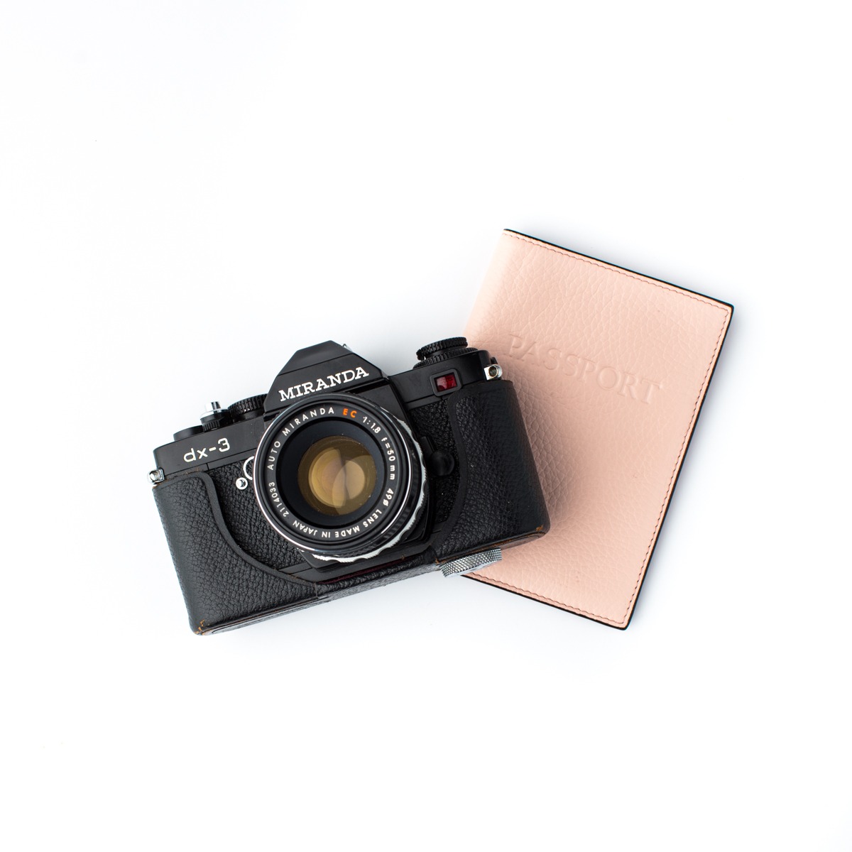 Camera with pink notebook