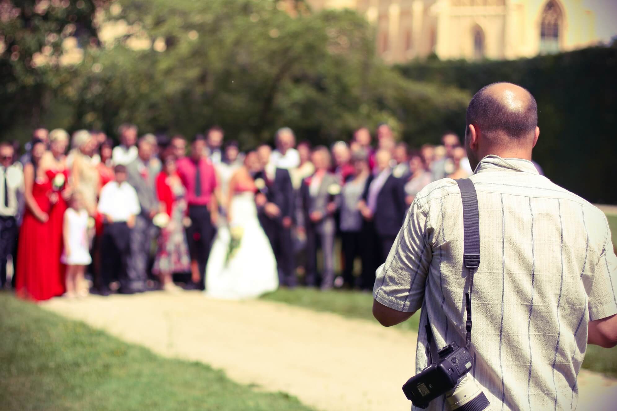 Photographer in front of a wedding party