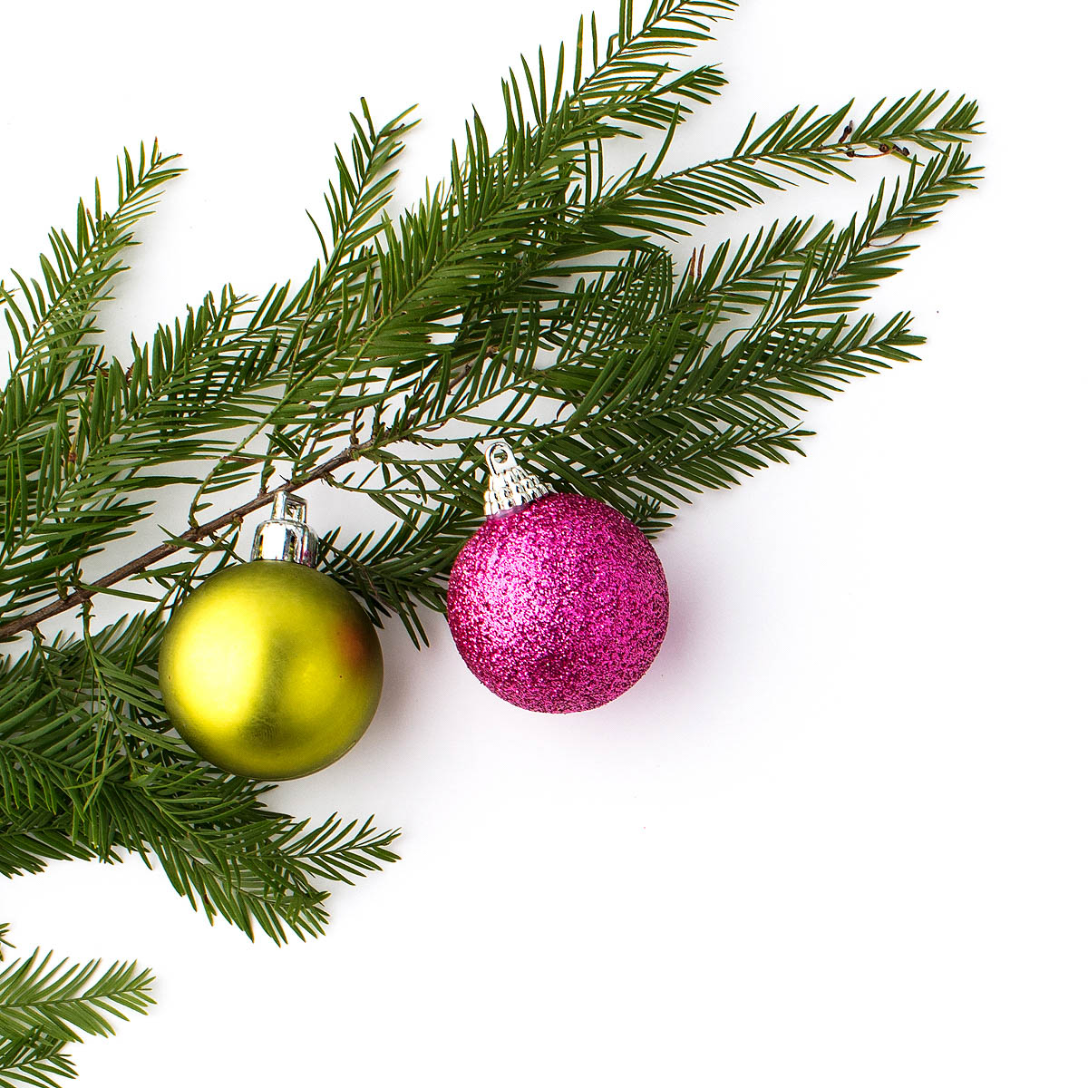 Christmas tree with two coloured baubles